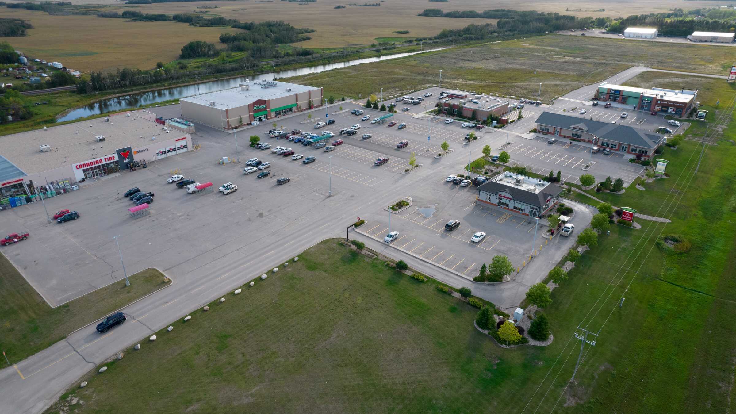 Aerial view of Quill Centre showing Canadian Tire, Sobeys, Tim Hortons, Pet Valu, and neighbouring businesses in Humboldt